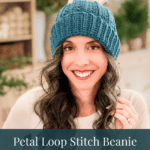 A woman smiling while wearing a teal Petal Loop Stitch Beanie; text overlaid at the bottom says “FREE CROCHET PATTERN • 8 SIZES.”