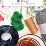 Crochet supplies including yarn, wire coils, green moss, and gold scissors, with text overlay titled “The Secret to a Witch Hat Brim That Holds Its Shape” for a crochet witch hat pattern.