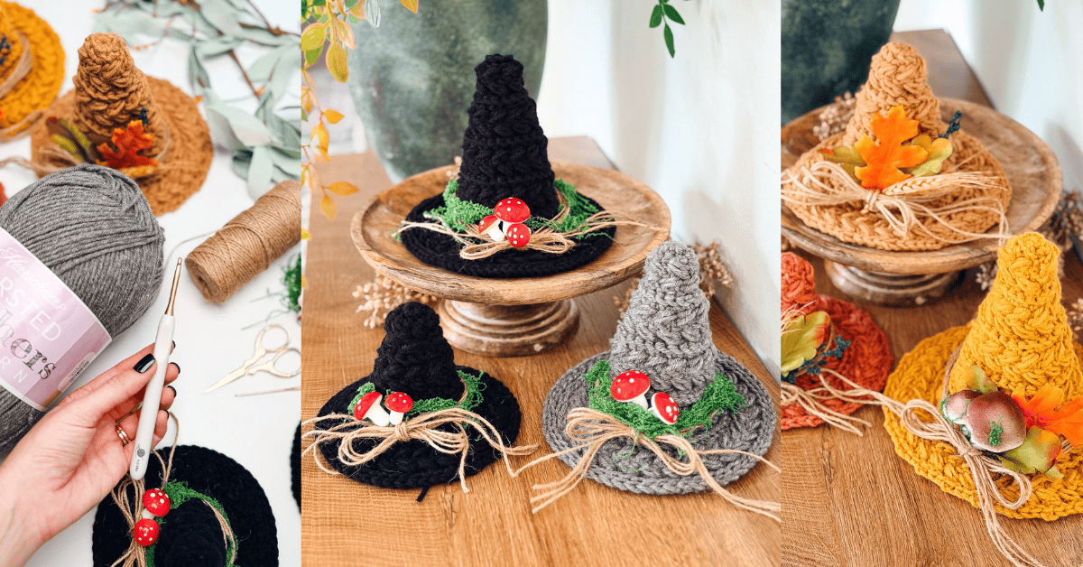 A hand holds a crochet hook near several completed mini crochet witch hats decorated with faux moss, twine, and red mushrooms.
