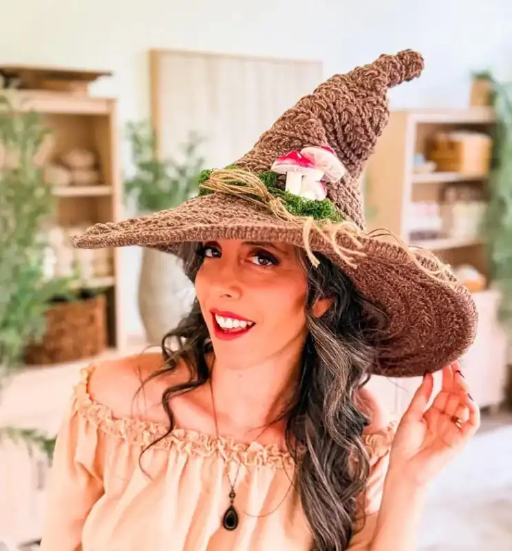 Briana K wearing her Wheat Stitch Witch Hat