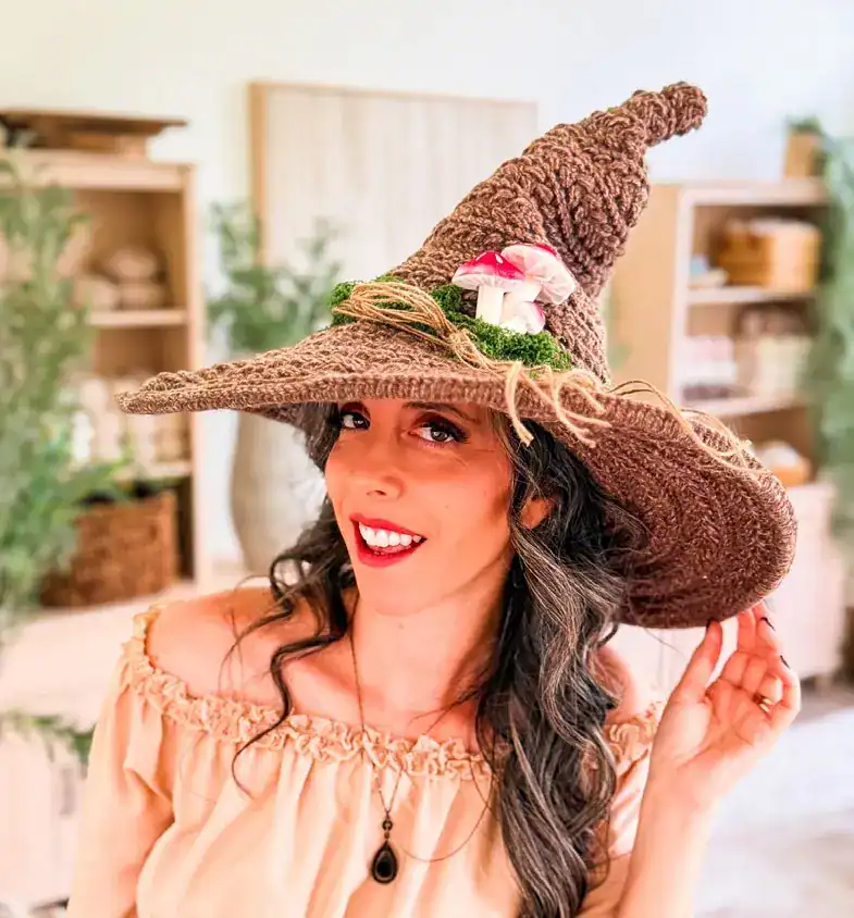 Briana K wearing her Wheat Stitch Witch Hat