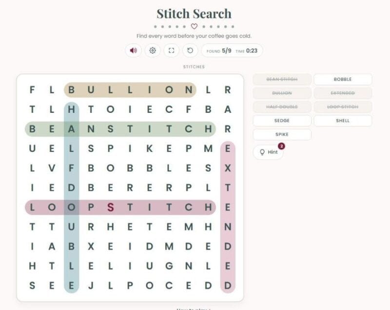 Stitch Search with a hint used, the first letter of a hidden word highlighted in berry