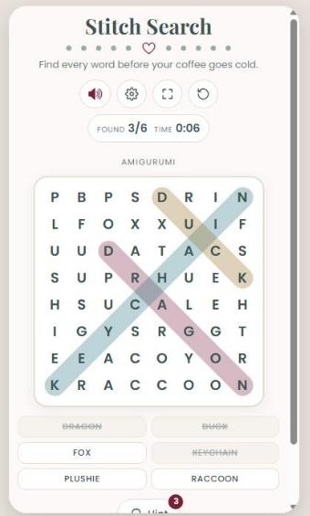 Stitch Search on a phone screen with the Amigurumi word pack on a small board, with diagonal words circled